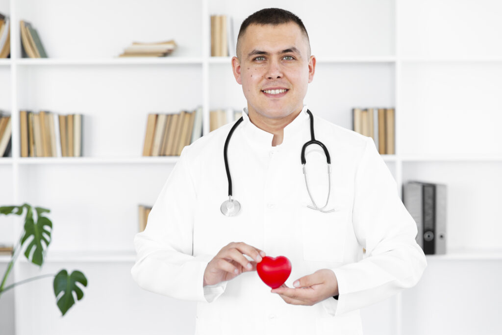 portrait male doctor holding plush heart (1)